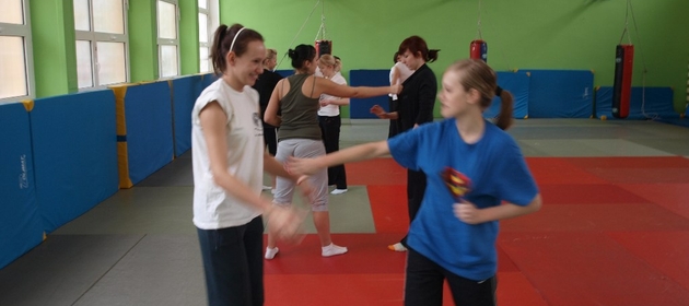 Students fighting on mats