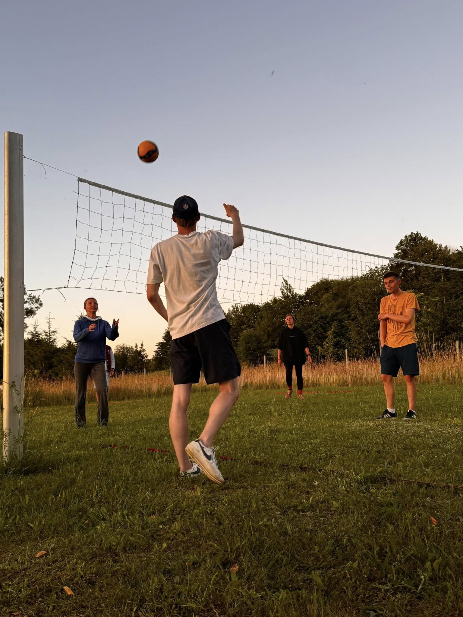 A photo of students taking part in the camp playing volleyball
